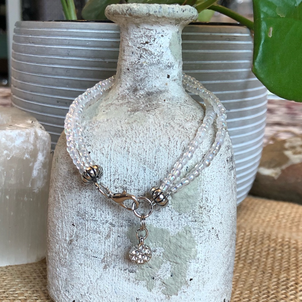 Two Strand Clear Glass And Silver Bracelet With Paved Charm